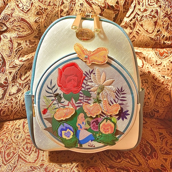 Disney Handbags - SOLD NWT Disney Alice in Wonderland Backpack. Reg $74.90